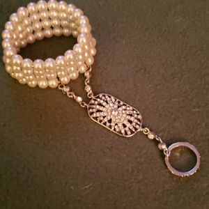 Pearl bangle with attached ring